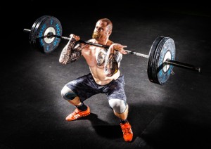 Man doing clean and press or clean and jerk